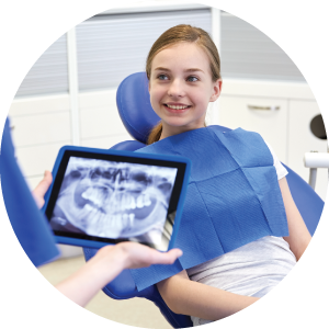 A dentist using digital X-Rays to help a patient's smile